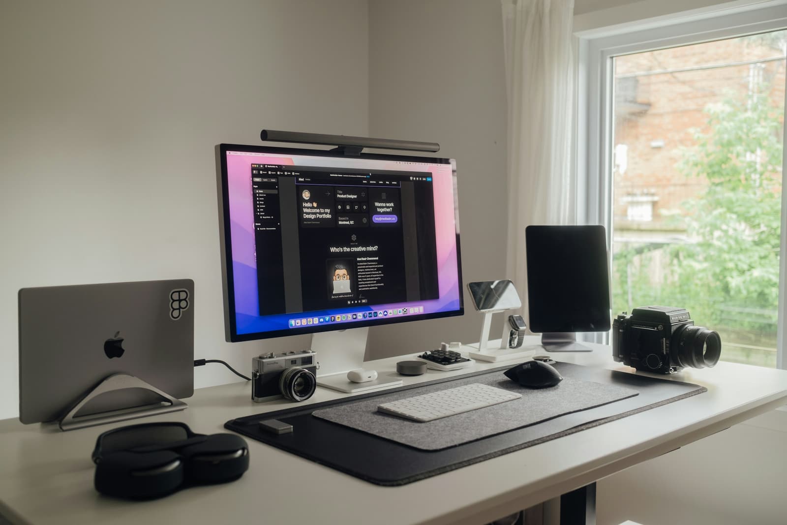 A Mac workstation set up on a clean desk