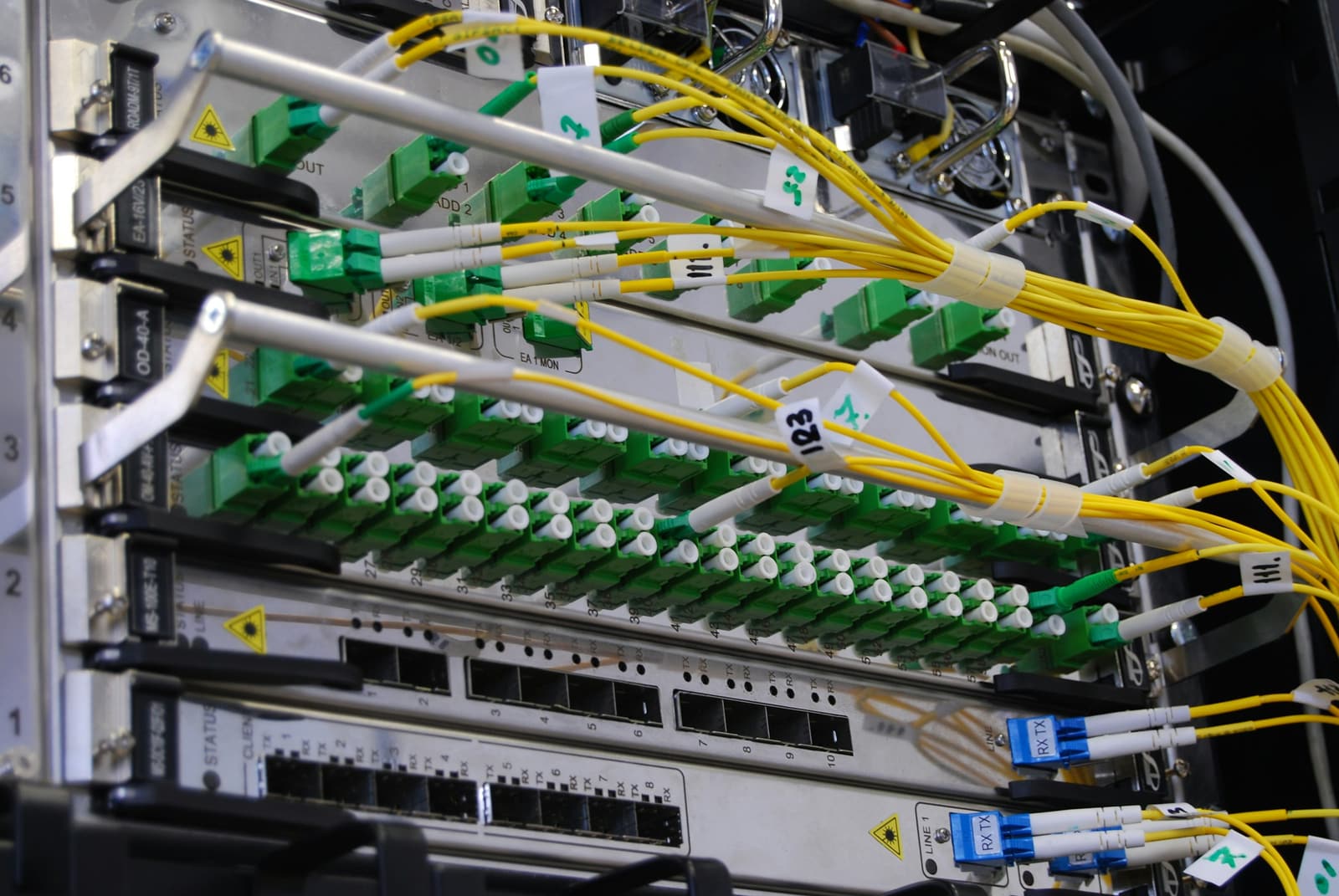Fiber optic patch panel with LC connectors seated in a switch