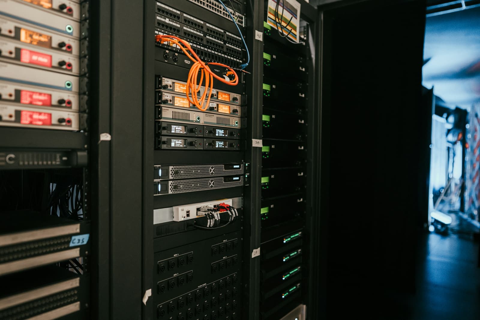 Rack-mounted equipment with cabling in a dark facility